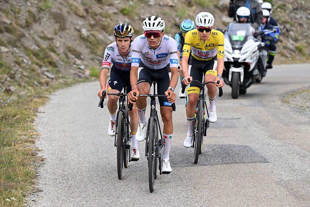ALPE D&amp;apos;HUEZ, FRANCE - JULY 25: (L-R) Remco Evenepoel of Belgium and Team Red Bull - BORA - hansgrohe, Isaac Del Toro of Mexico - White best Young Rider Jersey and Tadej Pogacar of Slovenia and UAE Team Emirates - XRG - Yellow Leader Jersey compete in the chase group during the 113th Tour de France 2026, Stage 20 a 170.9km stage from Le Bourg d&amp;apos;Oisans to Alpe d&amp;apos;Huez 1842m / #UCIWT / on July 25, 2026 in Alpe d&amp;apos;Huez, France. (Photo by Dario Belingheri/Getty Images)