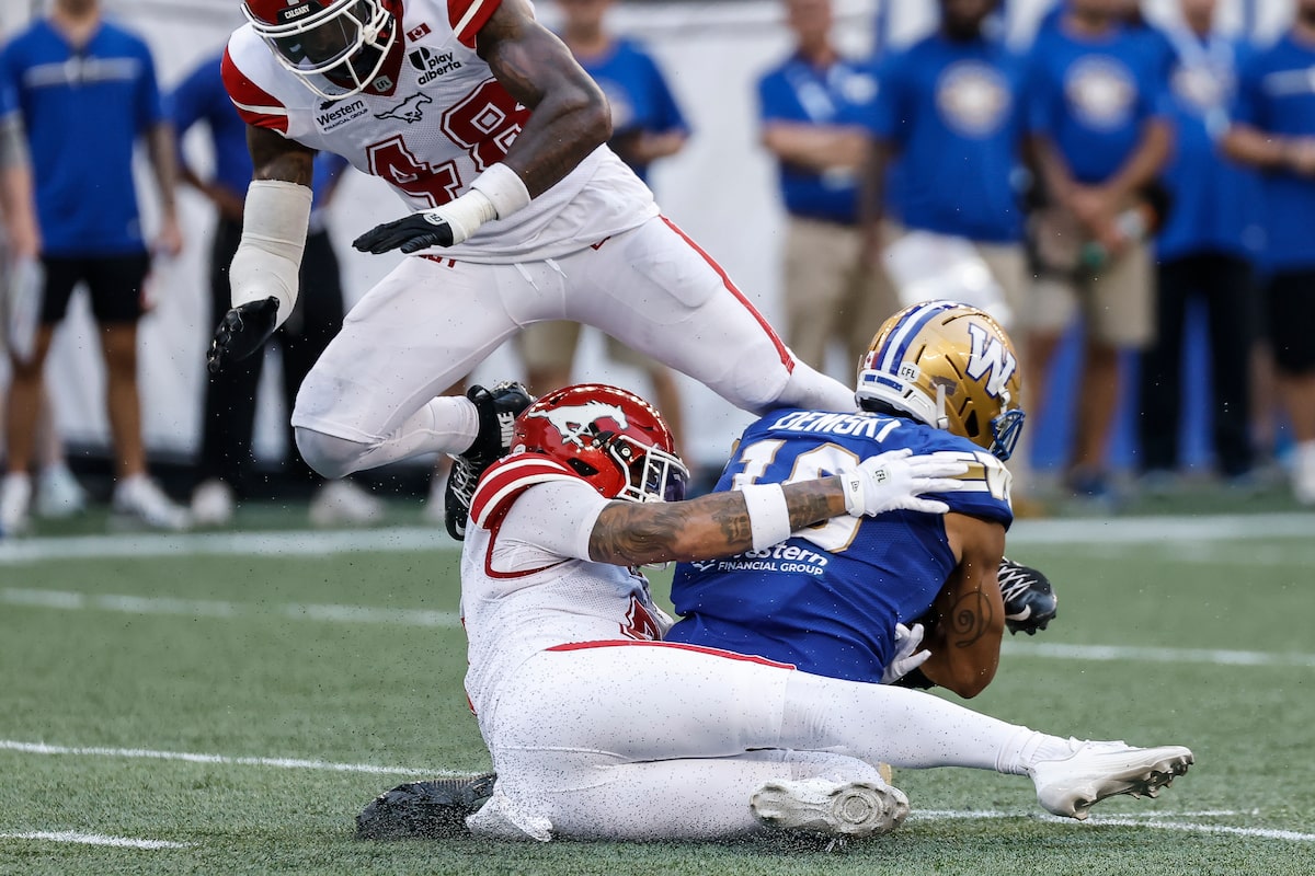 Stampeders stomp on Blue Bombers 52-30 while McAllister makes history