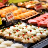 FILE PHOTO: Pufferfish sushi line is seen on a display window at a market in Shimonoseki, Japan February 7, 2020. Picture taken on February 7, 2020. REUTERS/Sakura Murakami/File Photo