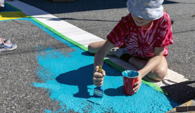 Community shows up to paint mural for Old City intersection