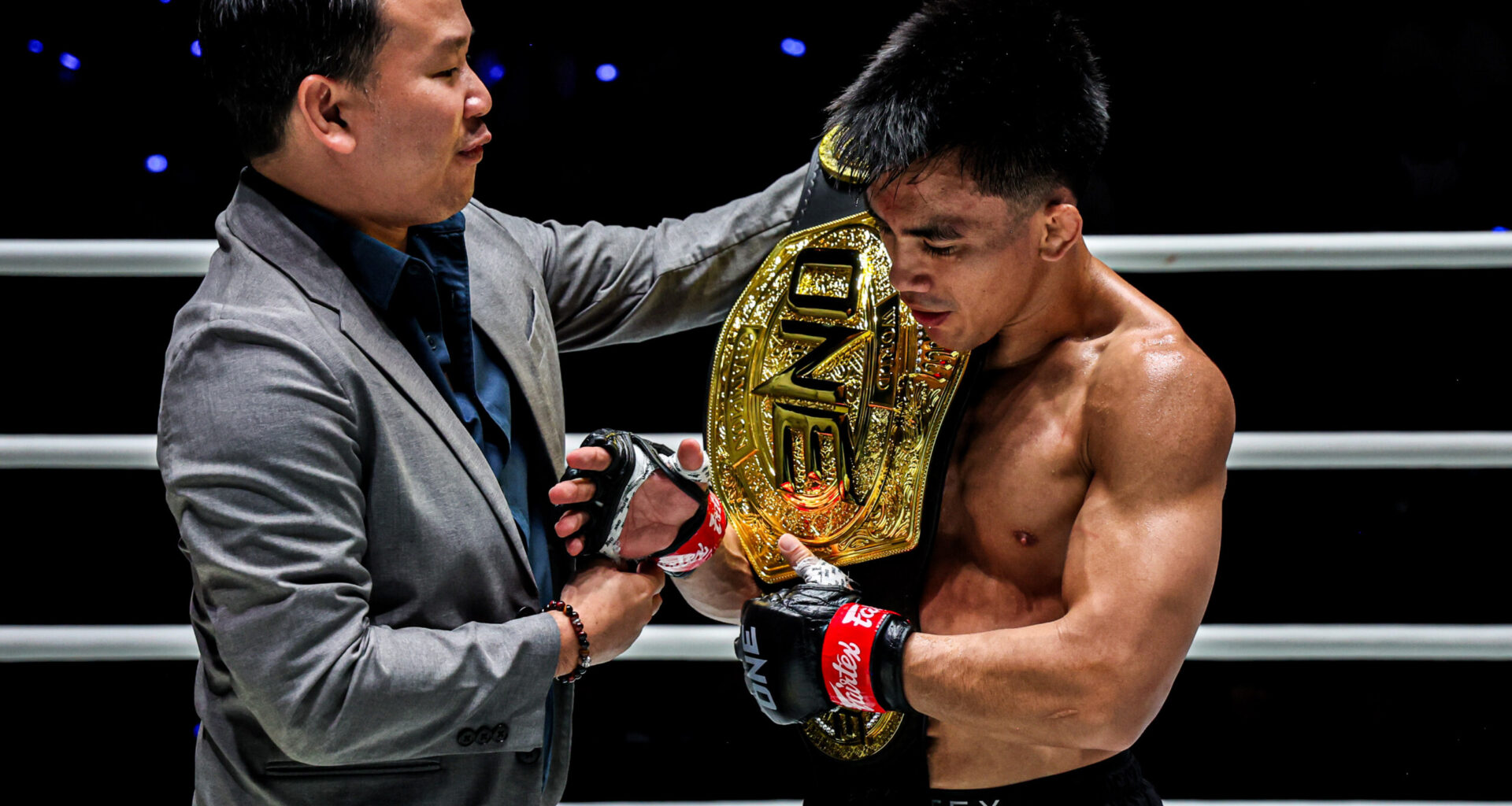 Plai hands Joshua Pacio the ONE Championship belt