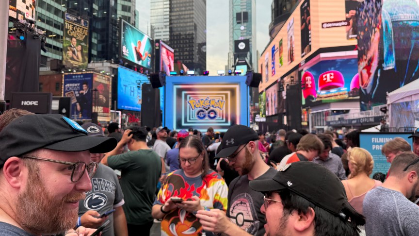 large crowd of people playing Pokemon Go
