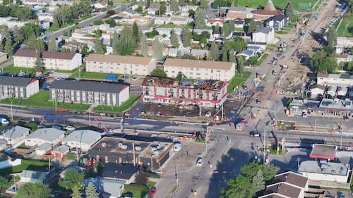 An aerial view of an apartment building at 82 Street and 132 Avenue in Edmonton the morning after a fatal fire on July 13, 2026. (Sean McClune / CTV News Edmonton)