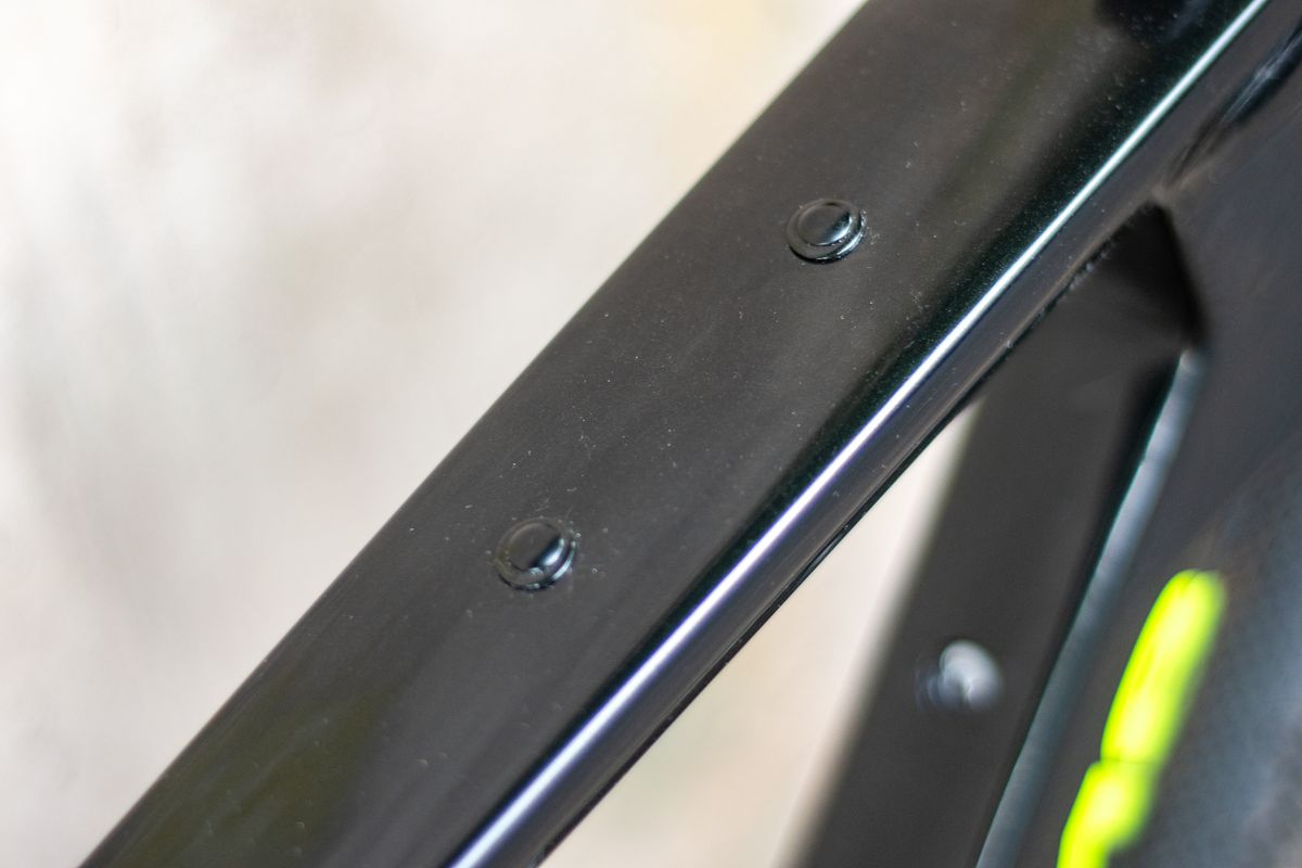 An Argon 18 Anti Matter gravel bike leaning against a concrete wall.