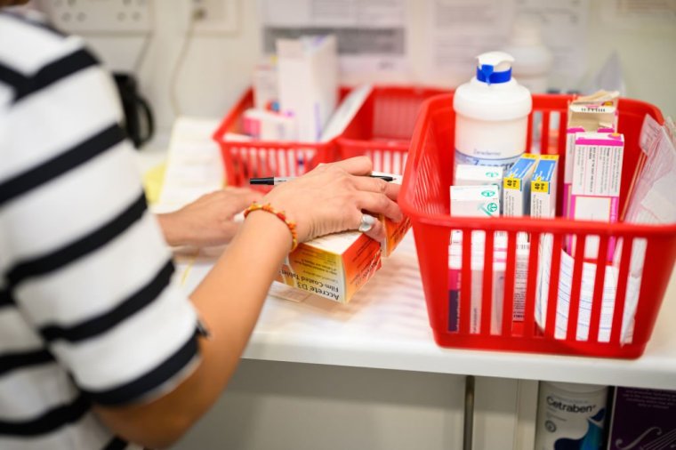 LONDON, ENGLAND - SEPTEMBER 19: A pharmacist prepares a prescription at the Keencare pharmacy, a member of the Green Light Group, on September 19, 2024 in London, England. UK Pharmacies vote today on whether to cut their opening hours from more than 60 per week to 40 in protest of the lack of government funding. The National Pharmacy Association (NPA) represents some 6,000 pharmacies across the UK and says 1500 have closed since 2016 because of higher workloads. Government funding has fallen by 40% in real terms since 2015-2016. (Photo by Leon Neal/Getty Images)