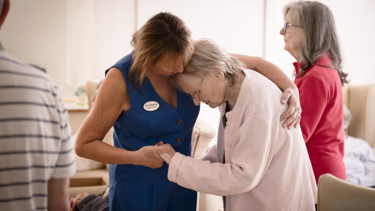 Story: The treatment by councils of care home residents who have lost their ability to pay. Kim Northwood, manager at The Gables Care Home in Kidderminster, Worcestershire, comforts a resident.