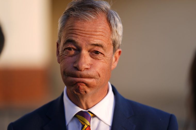 Reform UK leader Nigel Farage speaks to reporters as he arrives at a gathering for party supporters at Chelmsford City Racecourse, Essex, following the 2026 election results. Picture date: Friday May 8, 2026. PA Photo. Sir Keir Starmer's position in No 10 is under intense pressure after an electoral mauling in Labour's heartlands saw Nigel Farage's Reform UK make stunning gains. Photo credit should read: Jordan Pettitt/PA Wire