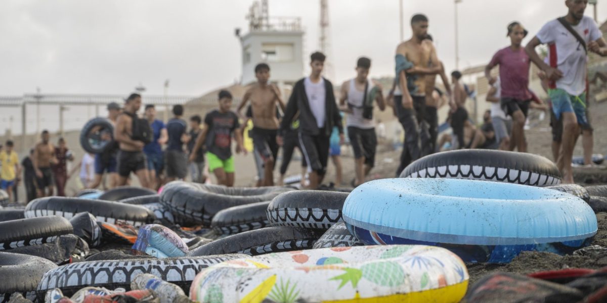 CEUTA, SPAIN - JULY 30: Hundreds of migrants have attempted to swim from Morocco to the Spanish city of Ceuta in North Africa, while the number of arrivals exceeded 1,500 in just over a week, according to local news in Cueta, Spain on July 30, 2026. As Moroccan and Algerian migrants attempted to reach Ceuta by swimming, most were reportedly intercepted by Moroccan patrol boats. Spain's Maritime Rescue Service and the Spanish Red Cross rescued 117 people from the water, while the Civil Guard assisted around 200 others with patrol boats. The Spanish Civil Guard also found two bodies which raised the death toll along Ceuta's coastline so far this year to 29. (Photo by Marcos Moreno/Anadolu via Getty Images)