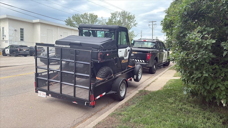 Calgary police are seen at Thorncliffe School in the 500 block of Thornton Road N.W. on Friday, July 17, 2026, as the search for a missing boy continues.