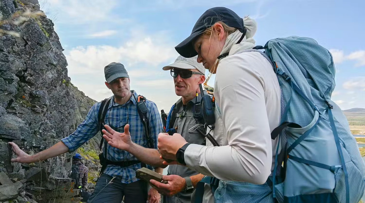 CANADIAN SPACE AGENCY: Gordon Osinski (centre) explains the processes that formed the 28-kilometre diameter Kamestastin Lake impact structure to Canadian Space Agency astronauts Jeremy Hansen (left) and Jenni Gibbons (right). (Canadian Space Agency)