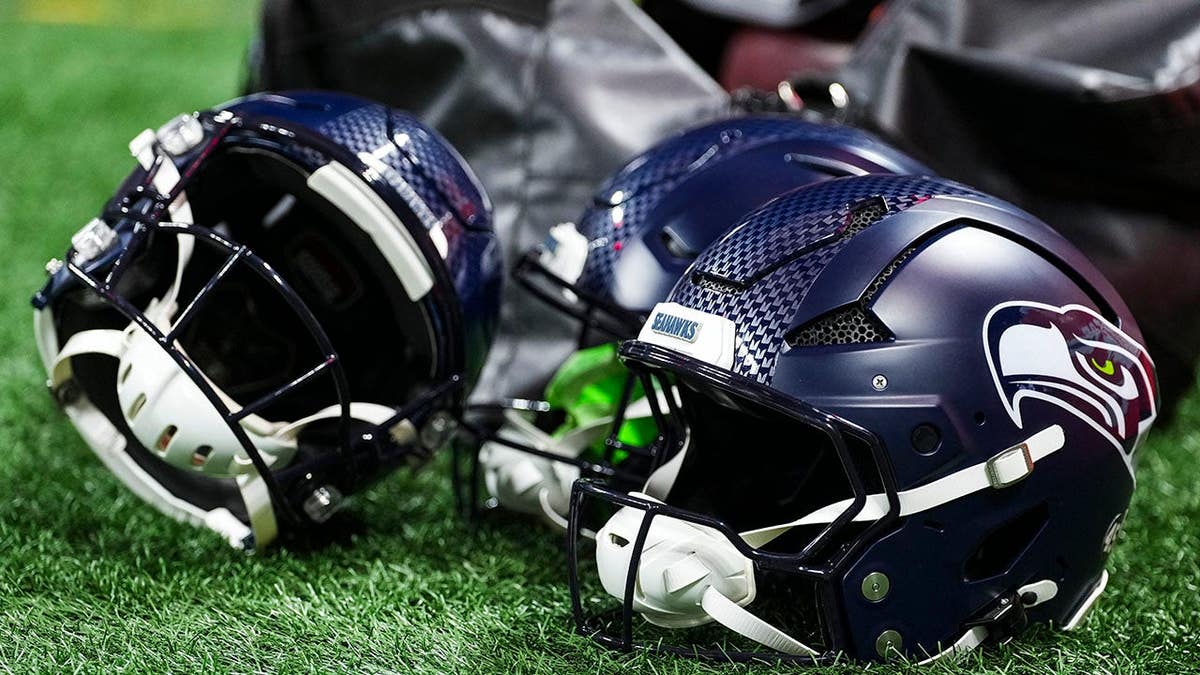 Seattle Seahawks helmets rest before an NFL football game in Atlanta.