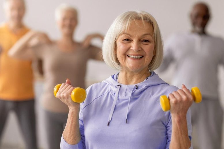 Senior Group Exercising With Weights
