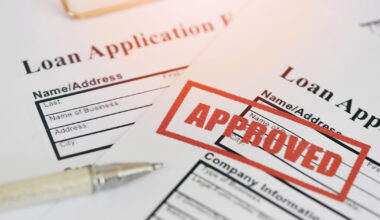 Loan approval, Loan application form with Rubber stamping that says Loan Approved, Financial loan money contract agreement company credit or person