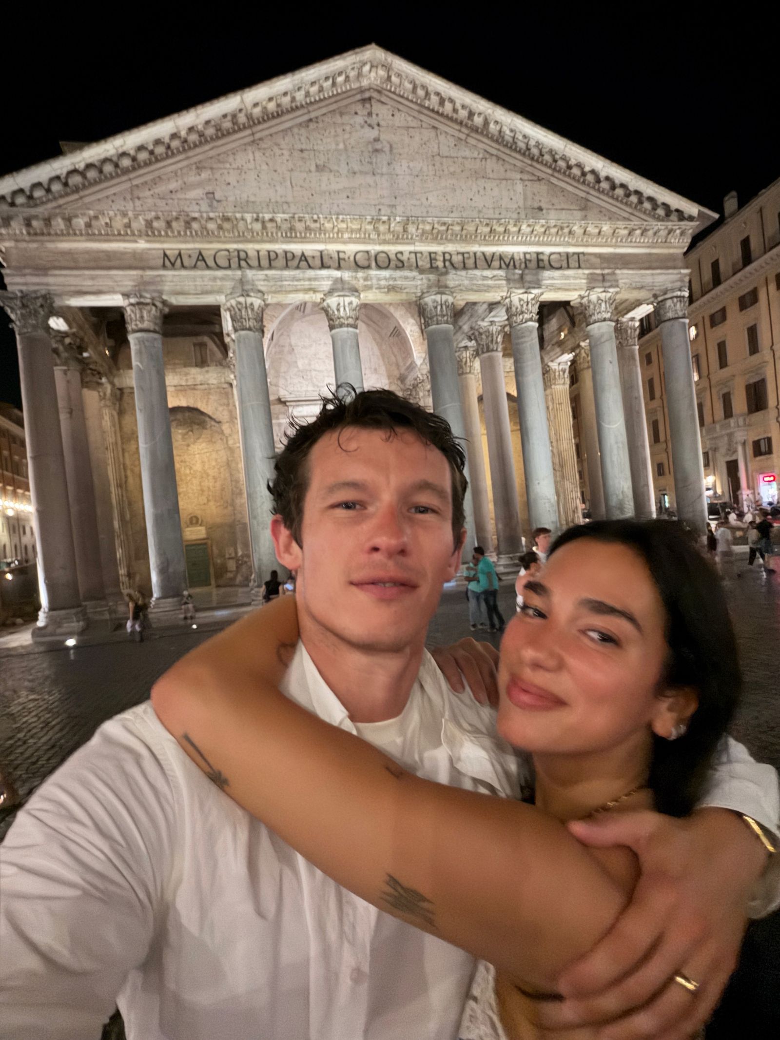 Image may contain Dua Lipa Callum Turner Adult Person Face Head Accessories Jewelry Necklace Ring and Photography