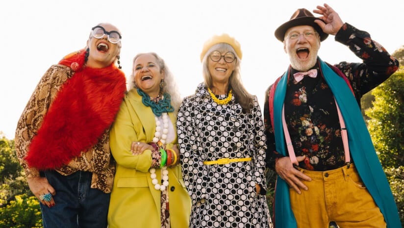 Image of a group of fashionable active older adults smiling