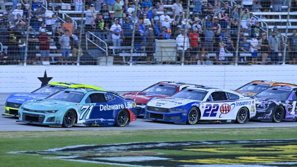 Joey Logano and Kyle Larson race side-by-side during a NASCAR Cup Series event at Texas Motor Speedway.