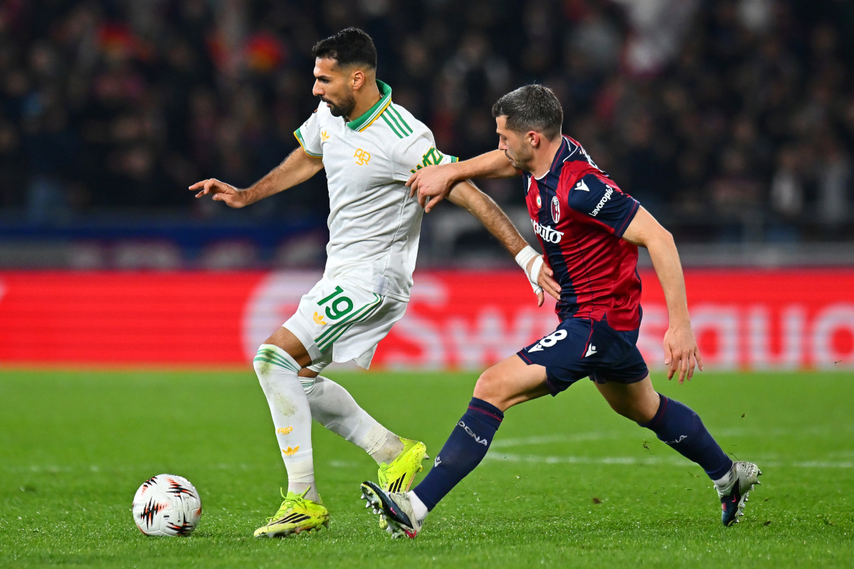 BOLOGNA, ITALY - MARCH 12: Zeki Celik of AS Roma is challenged by Remo Freuler of Bologna during the UEFA Europa League 2025/26 Round of 16 First Leg match between Bologna FC 1909 and AS Roma at Stadio Renato Dall
