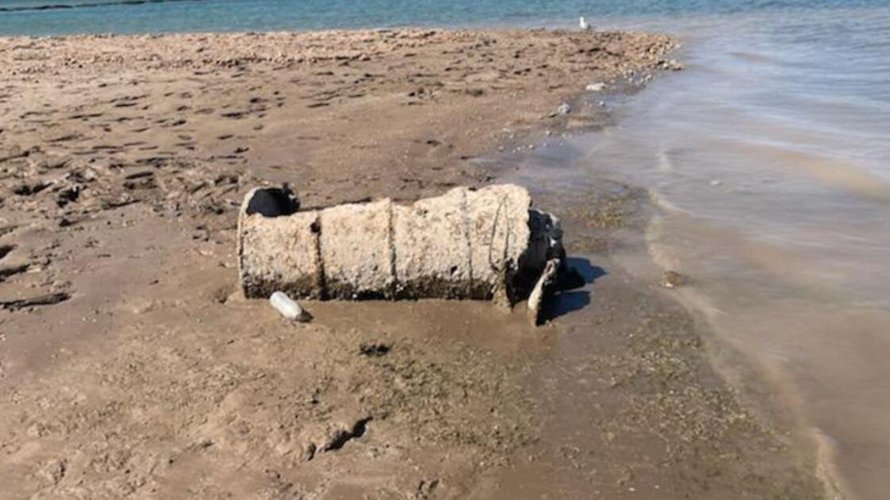 A rusted barrel lies on the exposed shoreline of Lake Mead as falling water levels continue to reveal long-submerged objects. A rusted barrel lies on the exposed shoreline of Lake Mead as falling water levels continue to reveal long-submerged objects