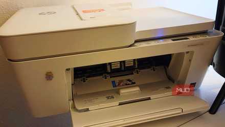 An opened printer, with cartridges being shown
