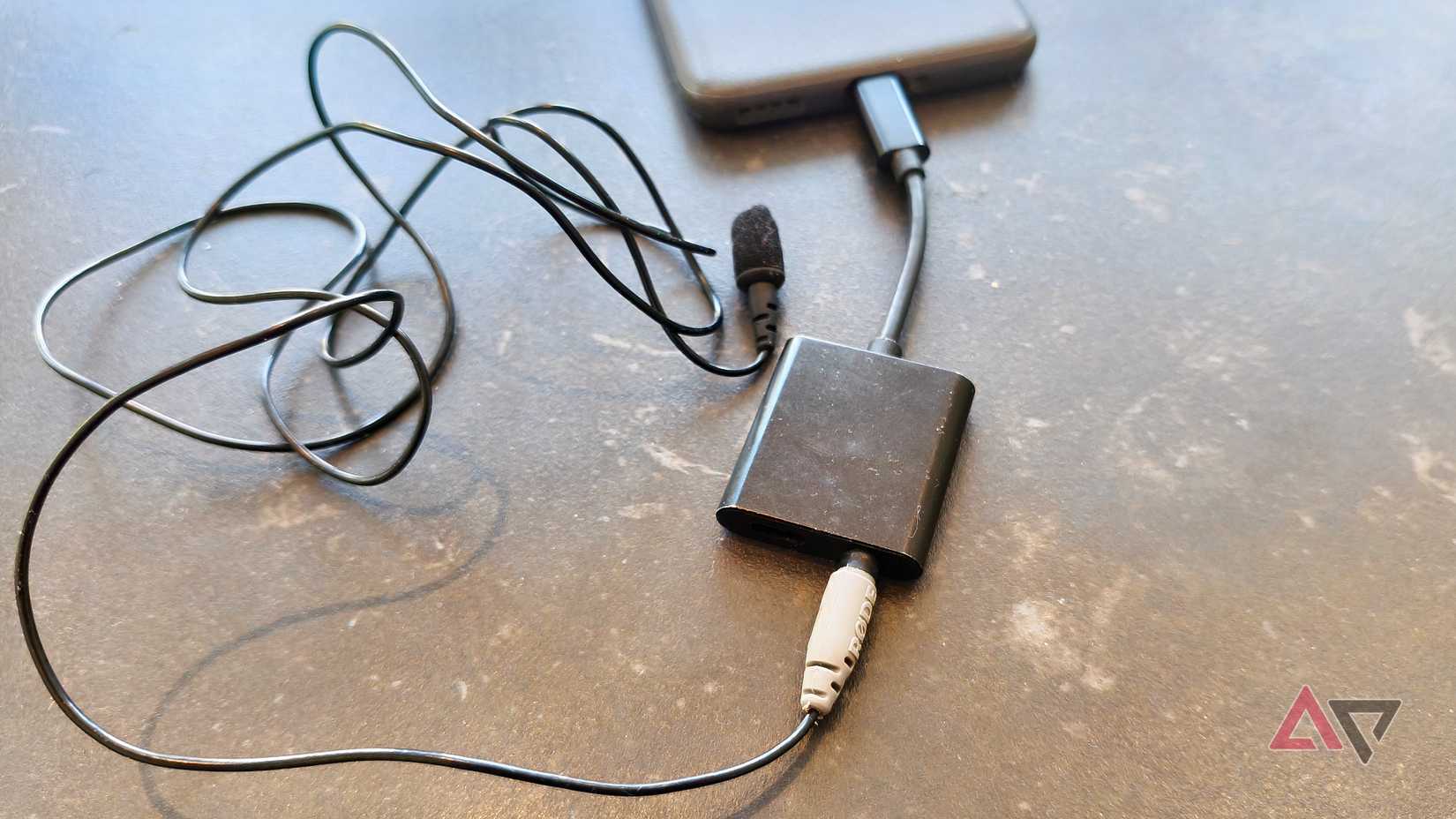 A USB-C / 3.5mm splitter plugged into a microphone and an Android phone.