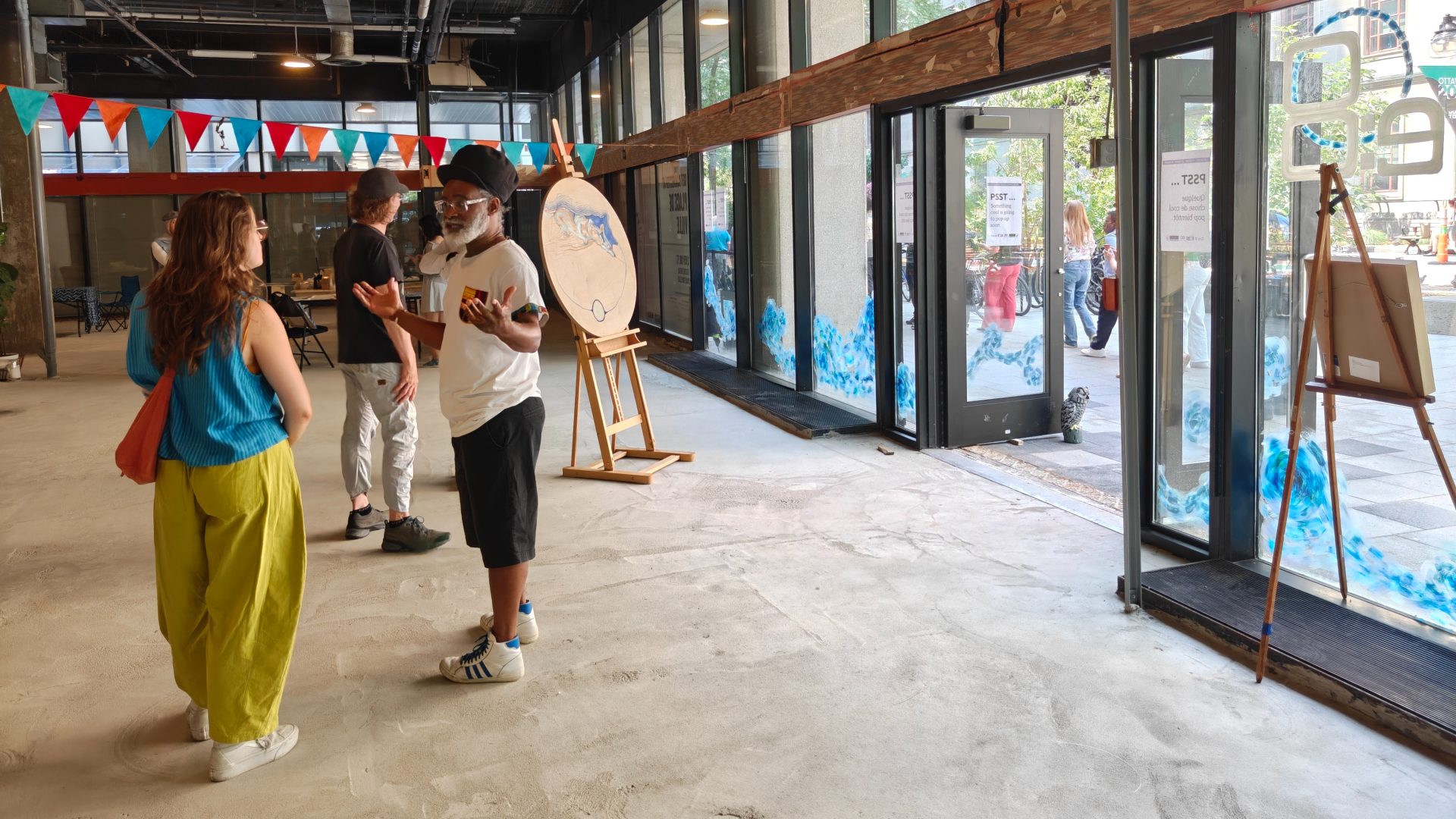 A vacant storefront in the Place de Ville complex has been temporarily transformed into a hub for artists. Photo credit: Valerie Stam