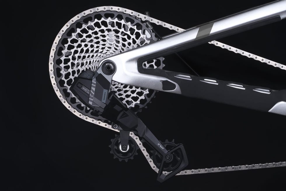 close-up of a 13-speed bicycle with a 52-tooth chainring in motion