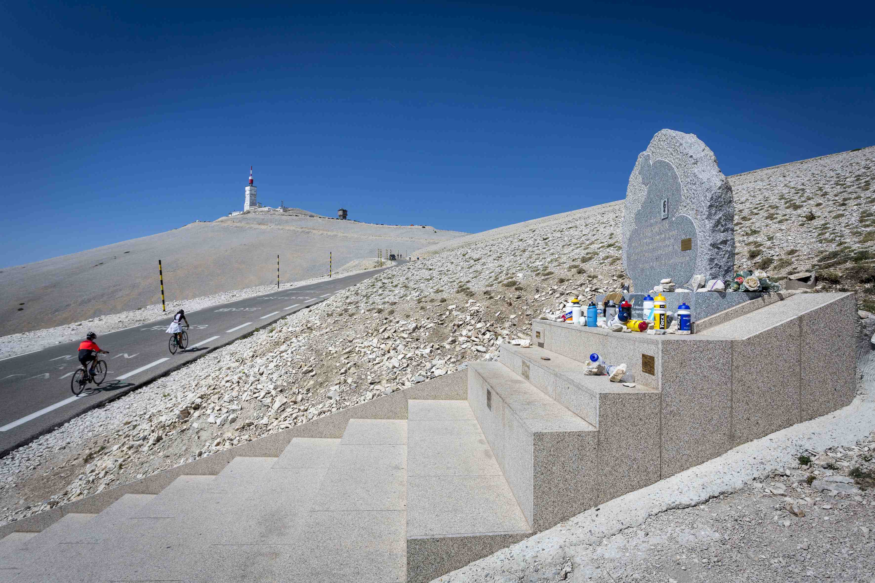 Cyclists climbing Mont Ventoux, passing by the memorial to cyclist Tom Simpson. (Photo by: Beucher/Andia/Universal Images Group via Getty Images)