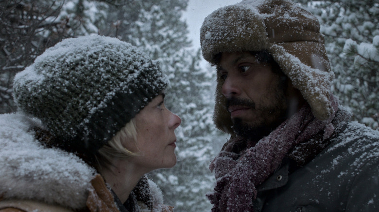 Rose (Jaime King) and Boone (Manuel Rodriguez-Saenz) looking at each other on 