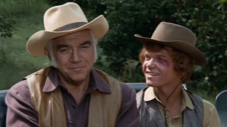 Jamie Hunter Cartwright (Mitch Vogel) smiles at Ben Cartwright (Lorne Greene) in Bonanza