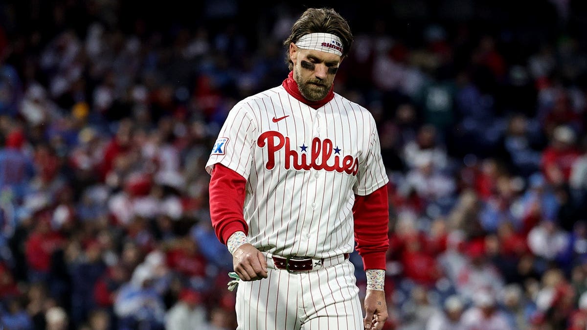 Bryce Harper standing on the field at Citizens Bank Park.