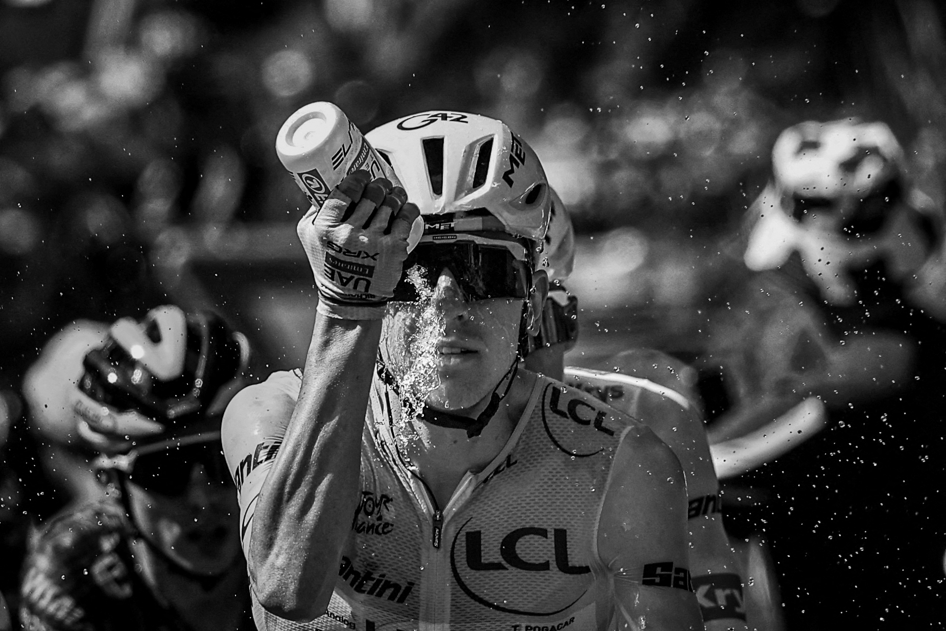 UAE Team Emirates - XRG's Slovenian rider Tadej Pogacar wearing the overall leader's yellow jersey douses himself with water to cool down during the 9th stage of the 113th edition of the Tour de France cycling race, 154,6 km between Malemort and Ussel in central France, on July 12, 2026. (Photo by Anne-Christine POUJOULAT / AFP)