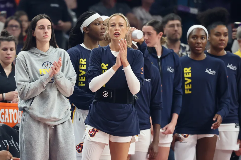 Caitlin Clark 22 and Sophie Cunningham 8 of the Indiana Fever react on the bench during the first half of the WNBA game against the Phoenix Mercury at Mortgage Matchup Center on July 09, 2026