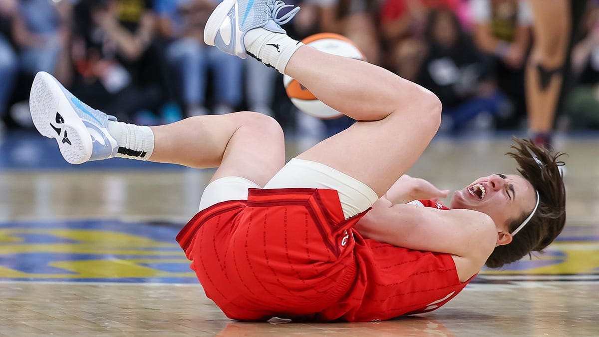 Caitlin Clark reacts after a flagrant foul committed by Diamond DeShields during a game at Wintrust Arena.