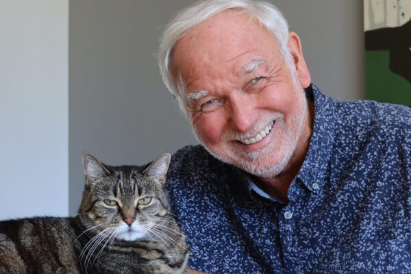 A man and a cat.