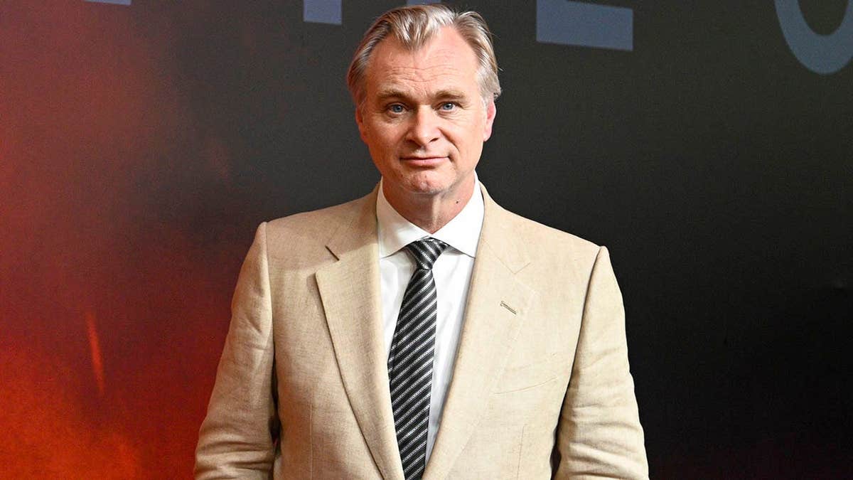 Christopher Nolan stands at the Universal Pictures The Odyssey premiere in Mumbai.