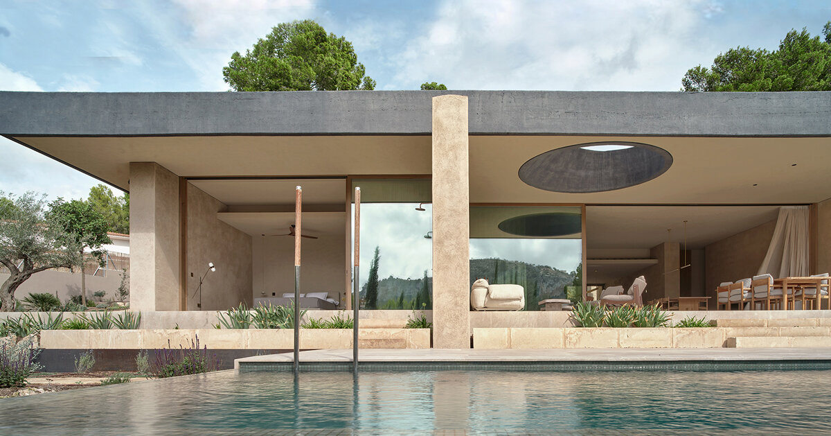 circular roof opening brings sunlight into casa óculo by OHLAB in palma