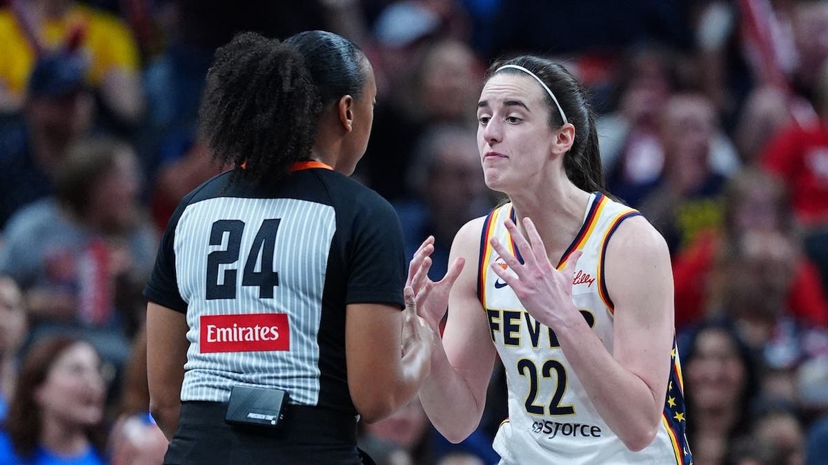 Caitlin Clark gestures at a referee during a game at Gainbridge Fieldhouse.