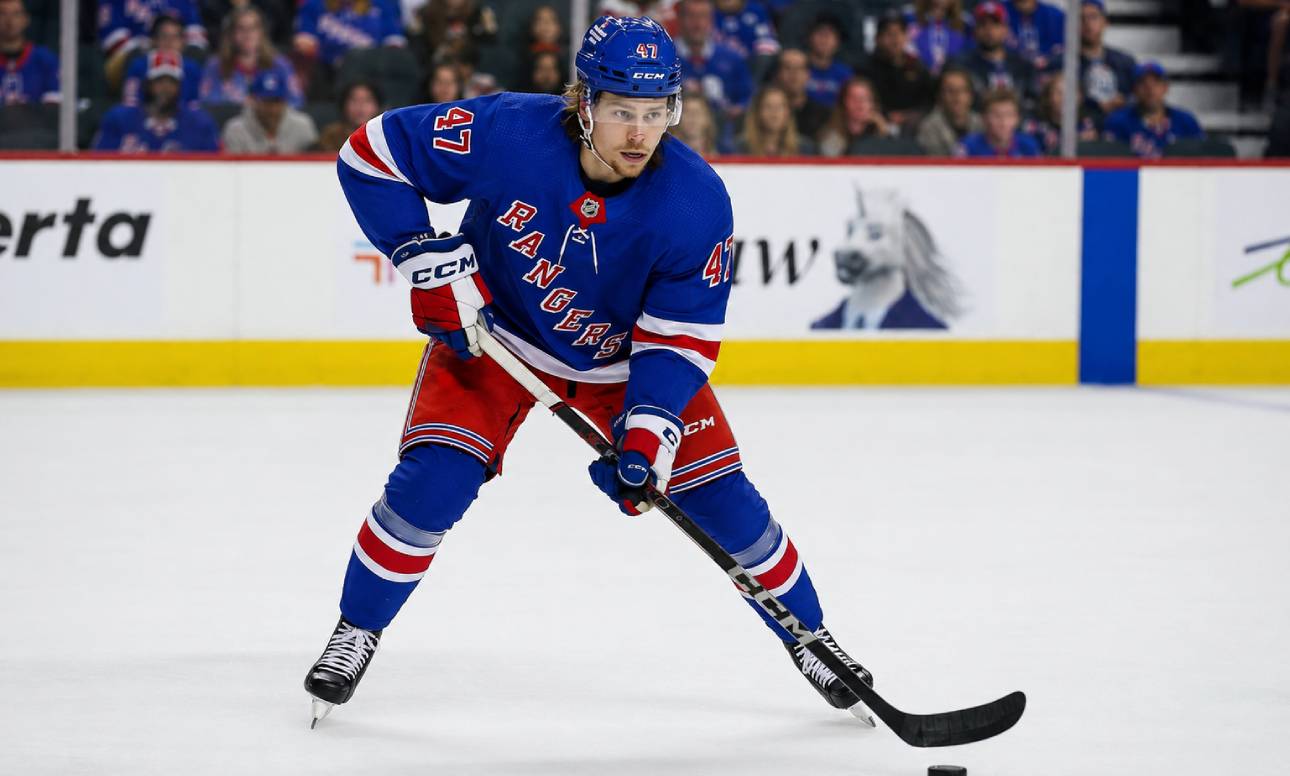 Connor Zary wearing a New York Rangers home jersey amid NHL trade rumors linking the Calgary Flames forward to New York