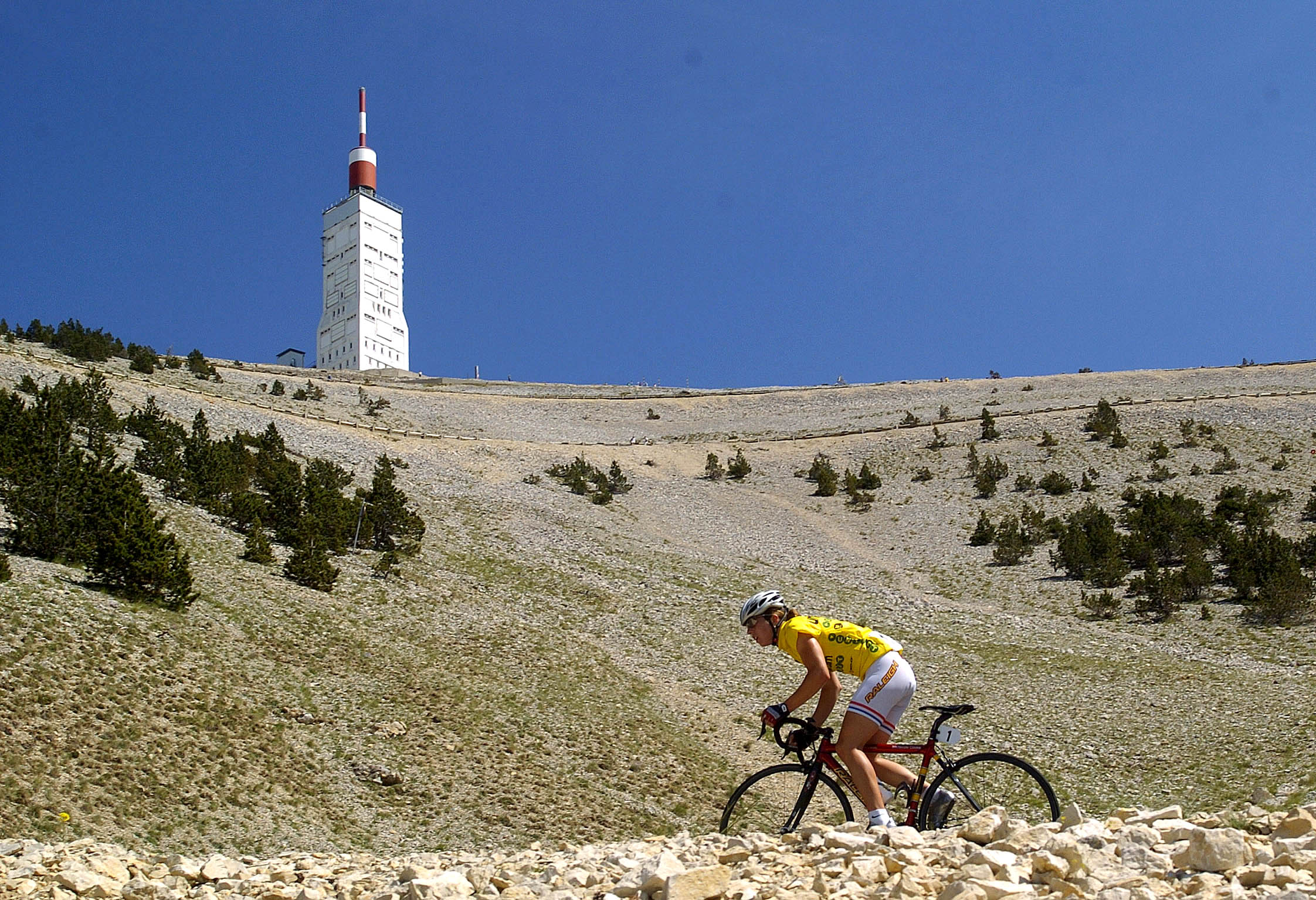Britain's Nicole Cooke rides during the fifth stage of the French "Grande Boucle" cycling race, with the summit of Mont Ventoux above her.