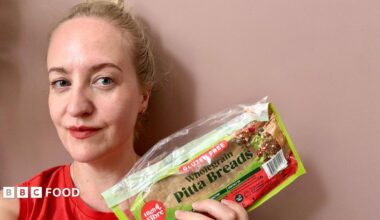 Lauren Potts holding a packet of gluten-free pitta bread