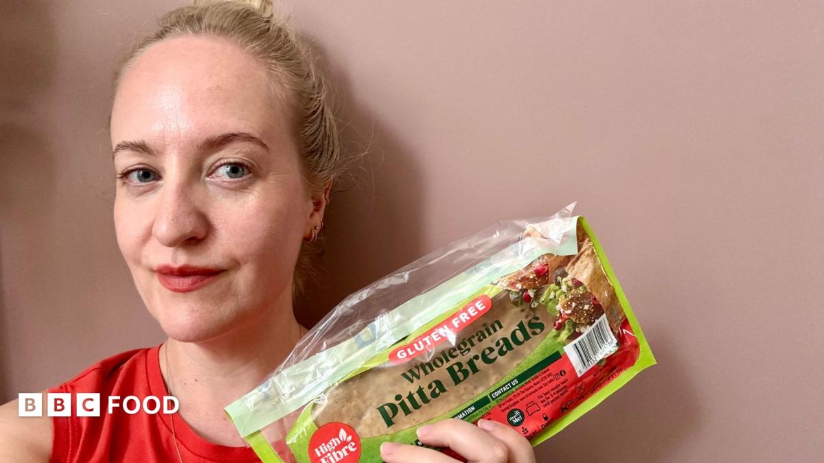 Lauren Potts holding a packet of gluten-free pitta bread