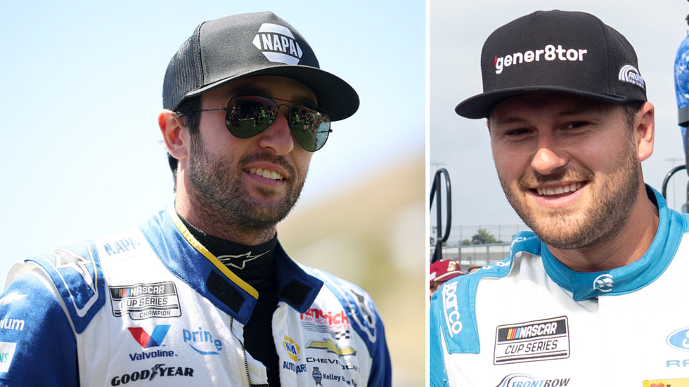 Two race car drivers wearing sunglasses and caps, smiling; one in a blue racing suit, the other in a white racing suit. Two race car drivers wearing sunglasses and caps, smiling; one in a blue racing suit, the other in a white racing suit.