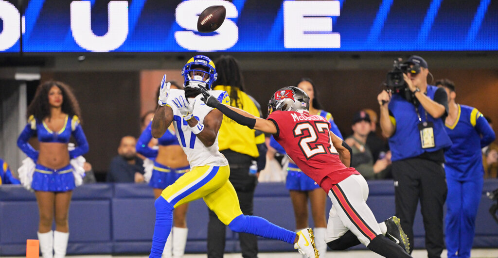 Nov 23, 2025; Inglewood, California, USA; Los Angeles Rams wide receiver Davante Adams (17) catches a twenty-four touchdown pass thrown by quarterback Matthew Stafford (not pictured) against Tampa Bay Buccaneers cornerback Zyon McCollum (27) during the second quarter at SoFi Stadium. Mandatory Credit: Jayne Kamin-Oncea-Imagn Images
