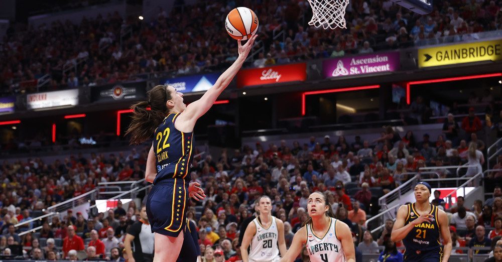 INDIANAPOLIS, IN - JULY 18: Indiana Fever guard Caitlin Clark (22) drives into the lane and goes up with her shot in the first half of play during a WNBA game between the New York Liberty and the Indiana Fever on July 18, 2026 at Gainbridge Fieldhouse in Indianapolis, IN.  (Photo by Jeffrey Brown/Icon Sportswire)