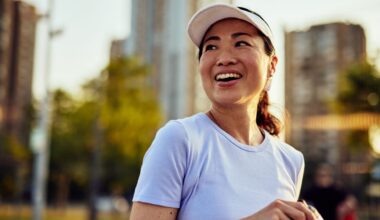 Woman laughing after playing tennis, smiling