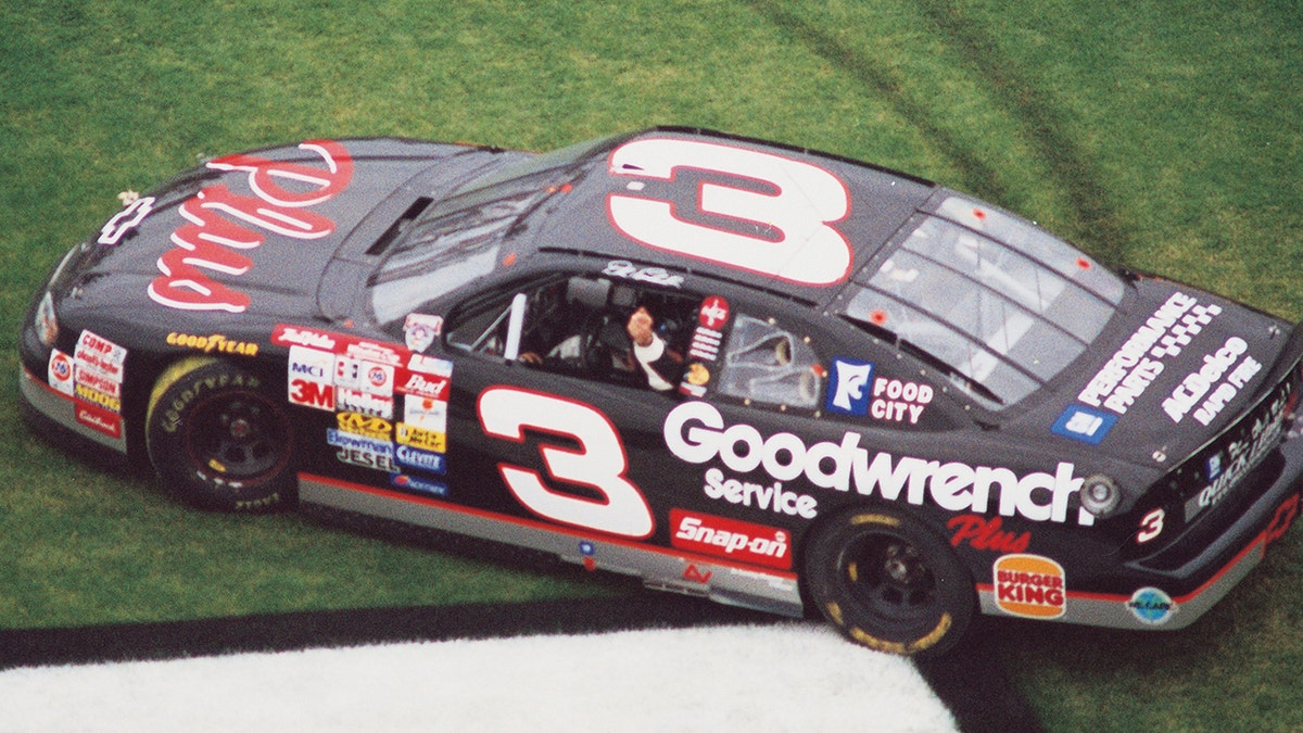 DAYTONA BEACH, FL - FEBRUARY 15: Dale Earnhardt Sr. (b. April 29, 1951 d. February 18, 2001) driver of the #3 GM Goodwrench Chevrolet celebrates in the infield grass after winning the 1998 NASCAR Winston Cup Daytona 500 at the Daytona International Speedway on February 15, 1998 in Daytona Beach, Florida. This was his 71st victory. (Photo by ISC Archives/CQ-Roll Call Group via Getty Images)