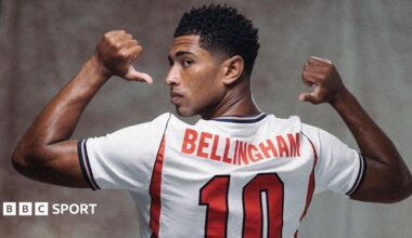 A picture of Jude Bellingham in a publicity shot wearing an England shirt, staring at the camera.