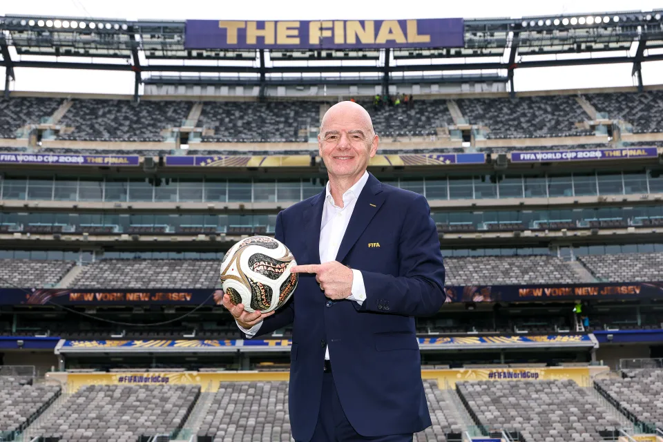 FIFA President Gianni Infantino poses with the TRIONDA FINAL the Official Match Ball for the semi-finals