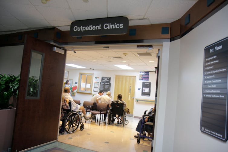 A sign reads 'outpatient clinic' above a doorway.