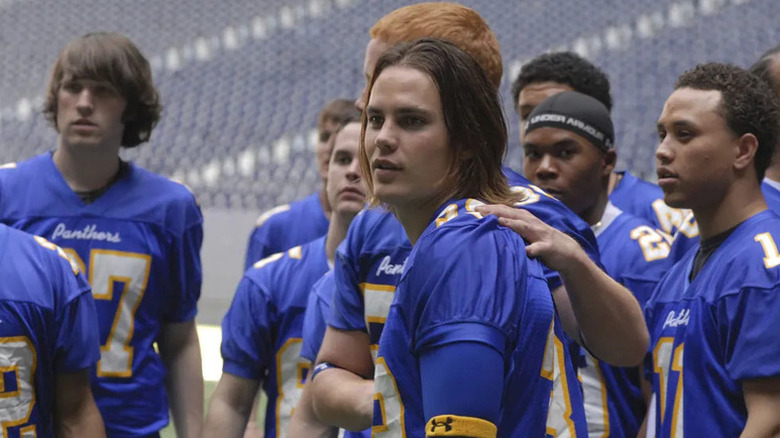Tim Riggins (Taylor Kitsch) stands on the sidelines in Friday Night Lights